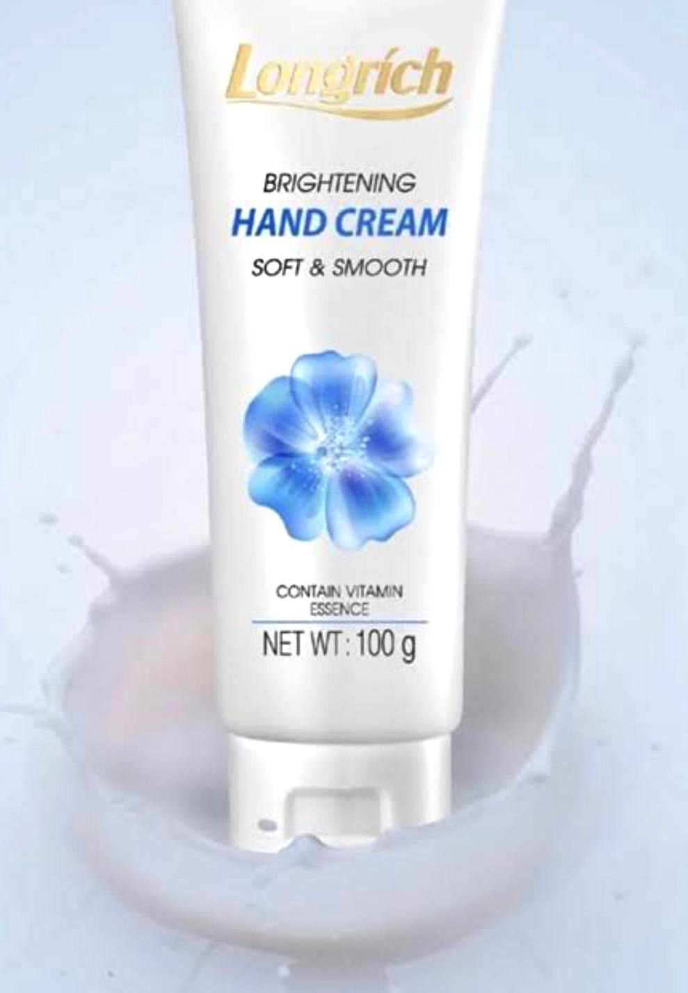 Longrich brightening hand cream tube with blue flower design on a light background