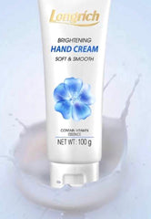 Longrich brightening hand cream tube with blue flower design on a light background
