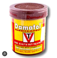 Damatol medicated hair, scalp, and skin treatment jar on a white background