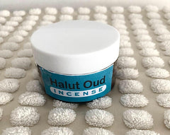 a jar of natural wood incense flakes